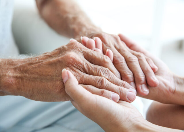 Two people holding hands.